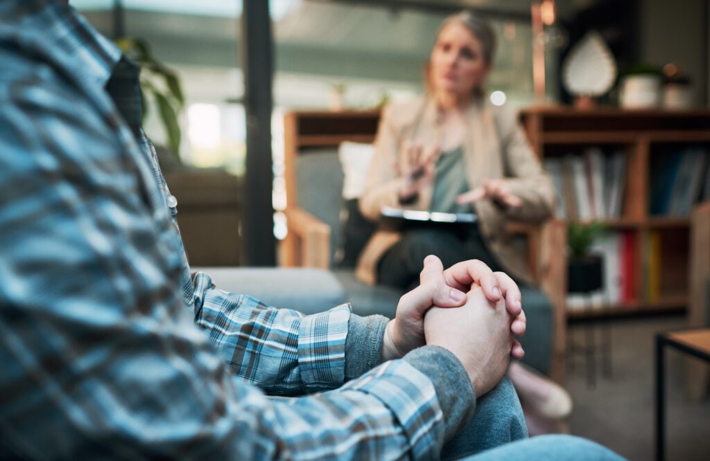 Cropped shot of a man having a therapeutic session with a psychologist